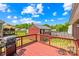 Inviting back deck with a gas grill and a charming view of the backyard shed on a sunny day at 201 Churchill Dr, Kings Mountain, NC 28086