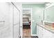 Well-lit bathroom features a shower and leads to the main bedroom at 201 Churchill Dr, Kings Mountain, NC 28086