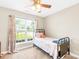 Bedroom with a twin bed and large window overlooking the front yard at 201 Churchill Dr, Kings Mountain, NC 28086