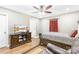 Bedroom with a ceiling fan, wood flooring and a large flat screen TV at 201 Churchill Dr, Kings Mountain, NC 28086