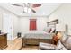 Bedroom with a ceiling fan, hardwood flooring, and a queen-sized bed at 201 Churchill Dr, Kings Mountain, NC 28086