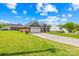 Well-manicured lawn leading to a charming brick home featuring an attached two-car garage at 201 Churchill Dr, Kings Mountain, NC 28086