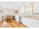 Eat-in kitchen with white cabinets, stainless appliances and wood-look flooring at 201 Churchill Dr, Kings Mountain, NC 28086