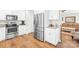 Modern kitchen featuring stainless steel appliances, granite countertops and sleek white cabinetry at 201 Churchill Dr, Kings Mountain, NC 28086
