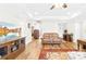 Cozy living room featuring modern lighting, wood floors, and beautiful furnishings at 201 Churchill Dr, Kings Mountain, NC 28086