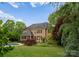 Expansive backyard with lush lawn, swimming pool, screen porch and mature landscaping for outdoor enjoyment at 2304 Thunder Gulch Ct, Waxhaw, NC 28173