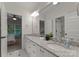 Bathroom featuring double sinks with granite countertop and a neutral color scheme at 2304 Thunder Gulch Ct, Waxhaw, NC 28173