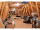 Spacious attic featuring exposed wooden beams, plywood flooring, and skylight for natural light at 2306 Beechwood Dr, Waxhaw, NC 28173