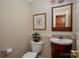 Stylish powder room features modern fixtures, decorative wallpaper, and charming accents at 2306 Beechwood Dr, Waxhaw, NC 28173