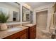 Dual sink bathroom featuring wood cabinets, granite countertops and shower/tub combo at 2306 Beechwood Dr, Waxhaw, NC 28173