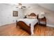 Comfortable bedroom featuring a ceiling fan and a bed with a wood frame at 2306 Beechwood Dr, Waxhaw, NC 28173