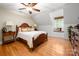 Bright bedroom featuring a window seat and bed with white blanket and decorative pillows at 2306 Beechwood Dr, Waxhaw, NC 28173