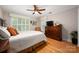 Comfortable bedroom offering hardwood floors, great natural light, and a serene atmosphere for relaxation at 2306 Beechwood Dr, Waxhaw, NC 28173