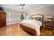 Bright bedroom with hardwood floors, large windows, and stylish furnishings for comfortable living at 2306 Beechwood Dr, Waxhaw, NC 28173