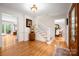 Inviting foyer with hardwood floors, white trim, and staircase leading to the upper level of the home at 2306 Beechwood Dr, Waxhaw, NC 28173
