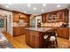 Spacious kitchen with a large granite island, custom cabinets, and stainless steel appliances at 2306 Beechwood Dr, Waxhaw, NC 28173