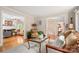 Cozy living room with a view of other spaces, hardwood floors, neutral furniture, and plenty of natural light at 2306 Beechwood Dr, Waxhaw, NC 28173