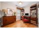 Charming office with hardwood floors, stylish desk, and ample storage for a productive workspace at 2306 Beechwood Dr, Waxhaw, NC 28173