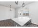 Living room with many windows for great natural light, and hardwood floors at 2311 Bulwarks Ct # 3P, Albemarle, NC 28001