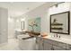 Elegant bathroom featuring a soaking tub, dual vanities, and a glass-enclosed shower at 2541 Kenmore Ave, Charlotte, NC 28204