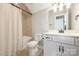 A well lit bathroom with a shower/tub combination and a single sink vanity at 2541 Kenmore Ave, Charlotte, NC 28204
