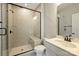 Modern bathroom with a glass-enclosed shower, sleek fixtures, and neutral color palette at 2541 Kenmore Ave, Charlotte, NC 28204