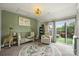 A charming Bedroom includes a baby crib, seating and access to an outdoor balcony at 2541 Kenmore Ave, Charlotte, NC 28204