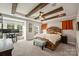 Spacious bedroom with wooden beams, ceiling fan, and large windows at 2541 Kenmore Ave, Charlotte, NC 28204