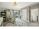Bedroom features a comfortable chair with access to an outdoor balcony and a view at 2541 Kenmore Ave, Charlotte, NC 28204