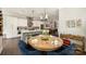Dining area with a wooden table, hardwood floors, and a view of the modern kitchen at 2541 Kenmore Ave, Charlotte, NC 28204