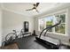 Well-lit exercise room with a treadmill, bike, and rubber flooring for a complete workout experience at 2541 Kenmore Ave, Charlotte, NC 28204