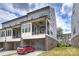An exterior shot of a modern townhome with a brick foundation and multiple stories at 2541 Kenmore Ave, Charlotte, NC 28204