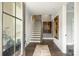 Spacious foyer with hardwood floors, staircase, and decorative art creating an inviting entrance at 2541 Kenmore Ave, Charlotte, NC 28204