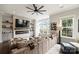 Cozy living room with a stone fireplace, large windows, and a comfortable sectional sofa at 2541 Kenmore Ave, Charlotte, NC 28204