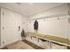 Organized mudroom with hooks, bench seating, and storage baskets for a tidy entryway at 2541 Kenmore Ave, Charlotte, NC 28204