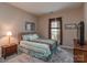 Comfortable bedroom featuring neutral walls, carpet flooring and natural light at 2603 Willis Dr, Harrisburg, NC 28075