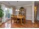 Cozy dining room featuring hardwood floors, natural light, and classic decor at 2603 Willis Dr, Harrisburg, NC 28075