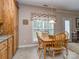 Bright kitchen nook with natural light, wood table and chairs, a quaint window, and decorative accents at 2603 Willis Dr, Harrisburg, NC 28075