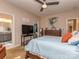Inviting main bedroom featuring a ceiling fan, closet access, and en suite bathroom access at 2603 Willis Dr, Harrisburg, NC 28075