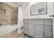 Bathroom featuring updated vanity, tiled shower, and modern fixtures at 2710 Red Bud Ln, Fort Mill, SC 29715