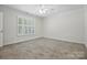 Bedroom with plantation shutters allowing natural light, creating a bright and airy space at 2710 Red Bud Ln, Fort Mill, SC 29715