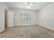 Bedroom featuring neutral walls, carpet flooring, and a window with shutters at 2710 Red Bud Ln, Fort Mill, SC 29715
