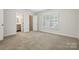 Bedroom featuring neutral walls, carpet flooring, and a window with shutters at 2710 Red Bud Ln, Fort Mill, SC 29715