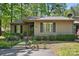 Lush greenery surrounds this charming home's front exterior at 2710 Red Bud Ln, Fort Mill, SC 29715