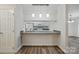 Charming kitchen featuring white cabinets, modern appliances, and breakfast bar with pendant lighting at 2710 Red Bud Ln, Fort Mill, SC 29715