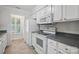 Bright kitchen featuring white cabinets, stainless appliances, and a view of the backyard at 2710 Red Bud Ln, Fort Mill, SC 29715