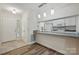 Charming kitchen with white cabinets, modern appliances, and a breakfast bar overlooking the entryway at 2710 Red Bud Ln, Fort Mill, SC 29715