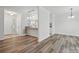 Inviting living room showcasing neutral walls, and updated flooring, and flows into kitchen area at 2710 Red Bud Ln, Fort Mill, SC 29715