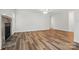 Open living room featuring wood floors, fireplace and bright white walls for a clean and modern feel at 2710 Red Bud Ln, Fort Mill, SC 29715