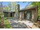 Back patio with stone chimney, perfect for outdoor entertaining and relaxation at 2710 Red Bud Ln, Fort Mill, SC 29715